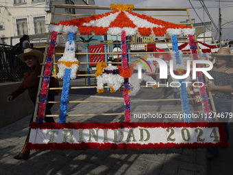 Inhabitants of Culhuacan in the extreme south of Mexico City are carrying a portada during a procession to the Sanctuary of the Lord of Calv...