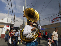 Musicians are accompanying residents of Culhuacan in the southernmost part of Mexico City during a procession to the Sanctuary of the Lord o...