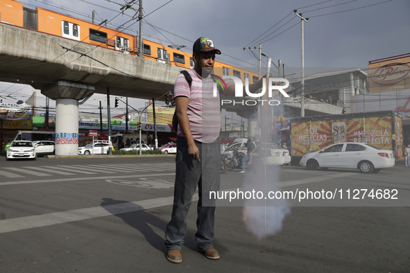 Inhabitants of Culhuacan in the extreme south of Mexico City are burning pyrotechnics during a procession to the Sanctuary of the Lord of Ca...