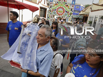 Inhabitants of Culhuacan in the extreme south of Mexico City are carrying religious images during a procession to the Sanctuary of the Lord...