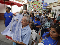 Inhabitants of Culhuacan in the extreme south of Mexico City are carrying religious images during a procession to the Sanctuary of the Lord...