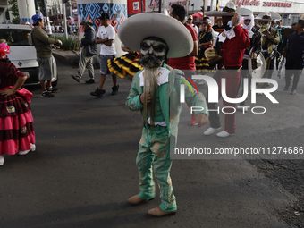 Inhabitants of Culhuacan in the extreme south of Mexico City are dancing during a procession to the Sanctuary of the Lord of Calvary on the...