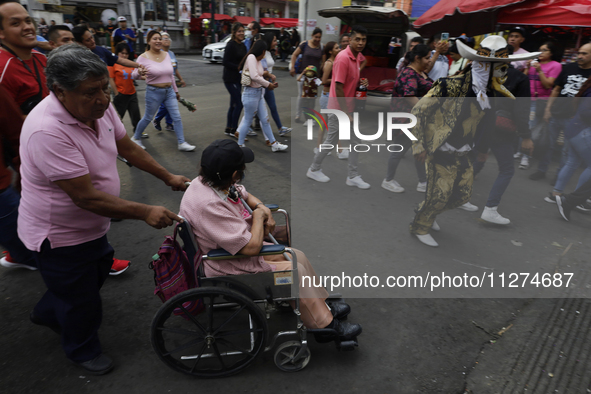 Inhabitants of Culhuacan in the extreme south of Mexico City are participating in a procession to the Sanctuary of the Lord of Calvary on th...