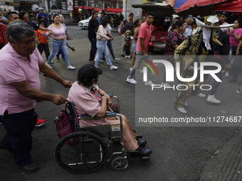 Inhabitants of Culhuacan in the extreme south of Mexico City are participating in a procession to the Sanctuary of the Lord of Calvary on th...