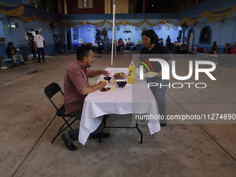 Inhabitants of Culhuacan in the extreme south of Mexico City are convivial during lunchtime at the end of a procession to the Sanctuary of t...