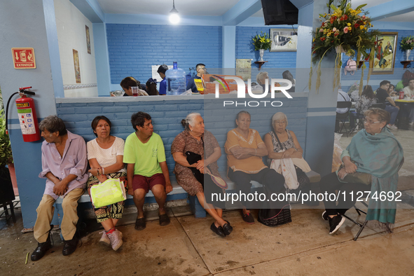 Inhabitants of Culhuacan in the extreme south of Mexico City are convivial during lunchtime at the end of a procession to the Sanctuary of t...