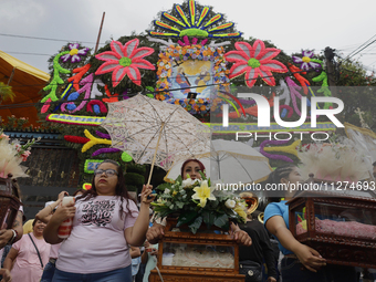 Inhabitants of Culhuacan in the extreme south of Mexico City are carrying religious images during a procession to the Sanctuary of the Lord...