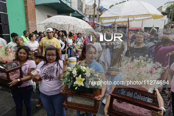 Inhabitants of Culhuacan in the extreme south of Mexico City are carrying religious images during a procession to the Sanctuary of the Lord...