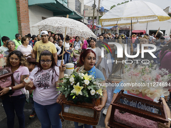 Inhabitants of Culhuacan in the extreme south of Mexico City are carrying religious images during a procession to the Sanctuary of the Lord...