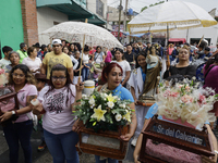 Inhabitants of Culhuacan in the extreme south of Mexico City are carrying religious images during a procession to the Sanctuary of the Lord...