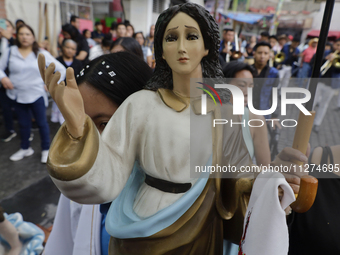 Inhabitants of Culhuacan in the extreme south of Mexico City are carrying religious images during a procession to the Sanctuary of the Lord...