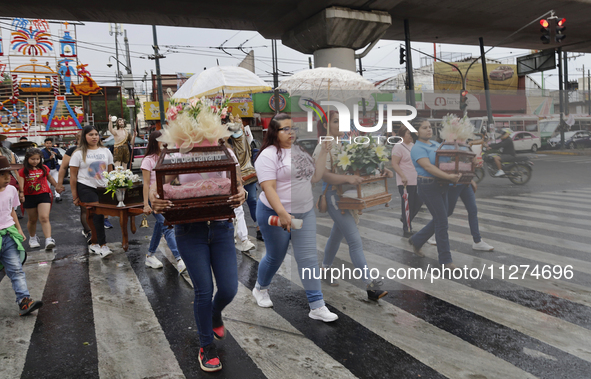 Inhabitants of Culhuacan in the extreme south of Mexico City are carrying religious images during a procession to the Sanctuary of the Lord...