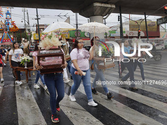 Inhabitants of Culhuacan in the extreme south of Mexico City are carrying religious images during a procession to the Sanctuary of the Lord...