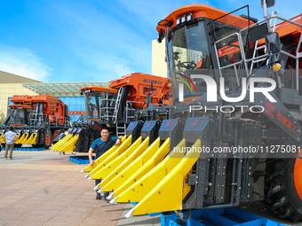 Various cotton picking machines are being displayed at the Railway Construction Heavy Industry Xinjiang Co LTD in the economic and technolog...