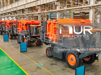 Packing cotton picking machines are being assembled at the Xinjiang Railway Construction Heavy Industry Co LTD in the economic and technolog...