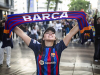Supporters of Barca are celebrating victory in the UEFA Women's Champions League final at the Canaletes fountain in Barcelona, Spain, on May...