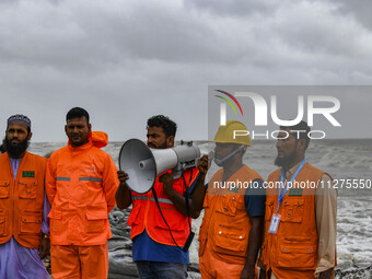 Cyclone Preparedness Program workers are using a megaphone at Kuakata beach area in Kuakata, Bangladesh, on May 26, 2024, ahead of Cyclone R...