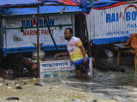 Local businesses are moving their belongings to another place in Kuakata, Bangladesh, on May 26, 2024, ahead of Cyclone Remal landfall. (