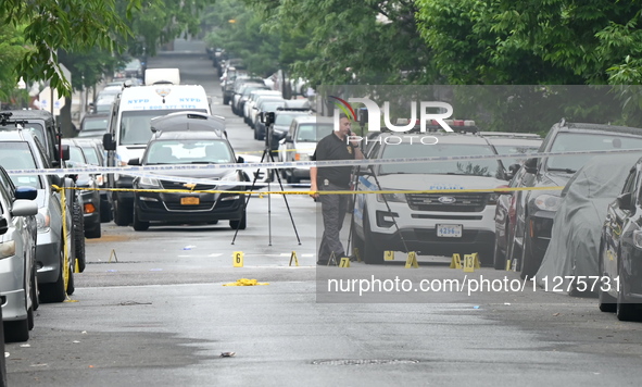 Evidence markers are down on the ground, highlighting the crime scene where an emotionally disturbed 26-year-old male is being shot and kill...