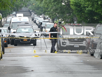 Evidence markers are down on the ground, highlighting the crime scene where an emotionally disturbed 26-year-old male is being shot and kill...