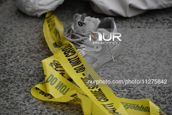 The aftermath scene of a pedestrian struck incident is being photographed in Brooklyn, New York, United States, on May 25, 2024. At approxim...