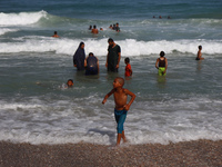 Palestinians are gathering on the beach in Deir el-Balah, central Gaza Strip, on May 26, 2024, amid the ongoing conflict between Israel and...