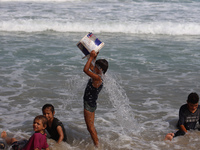 Palestinians are gathering on the beach in Deir el-Balah, central Gaza Strip, on May 26, 2024, amid the ongoing conflict between Israel and...