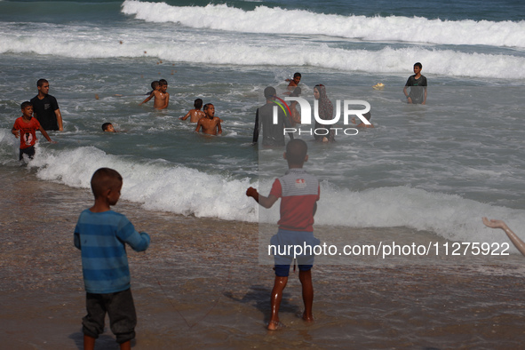 Palestinians are gathering on the beach in Deir el-Balah, central Gaza Strip, on May 26, 2024, amid the ongoing conflict between Israel and...