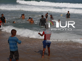 Palestinians are gathering on the beach in Deir el-Balah, central Gaza Strip, on May 26, 2024, amid the ongoing conflict between Israel and...