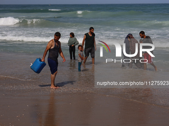 Palestinians are gathering on the beach in Deir el-Balah, central Gaza Strip, on May 26, 2024, amid the ongoing conflict between Israel and...