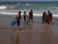 Palestinians are gathering on the beach in Deir el-Balah, central Gaza Strip, on May 26, 2024, amid the ongoing conflict between Israel and...