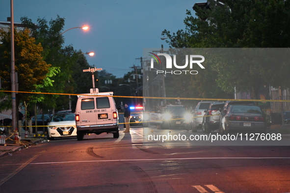 Police are present and evidence markers are highlighting shell casings at the crime scene. One person is killed and two people are injured i...