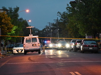 Police are present and evidence markers are highlighting shell casings at the crime scene. One person is killed and two people are injured i...