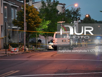 Police are present and evidence markers are highlighting shell casings at the crime scene. One person is killed and two people are injured i...