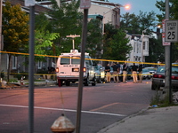 Police are present and evidence markers are highlighting shell casings at the crime scene. One person is killed and two people are injured i...