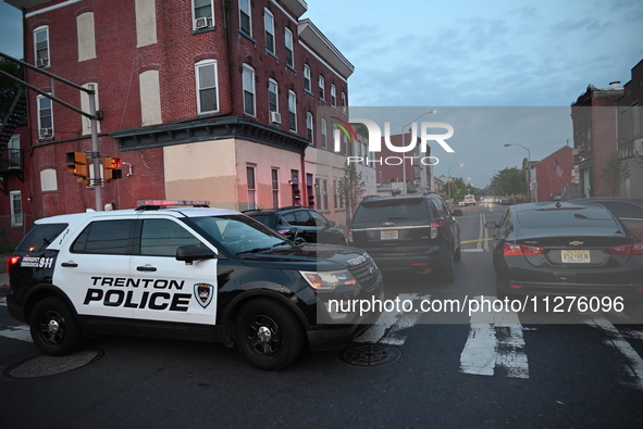 Police are present and evidence markers are highlighting shell casings at the crime scene. One person is killed and two people are injured i...