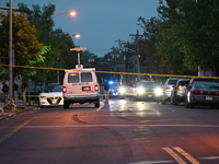 Police are present and evidence markers are highlighting shell casings at the crime scene. One person is killed and two people are injured i...