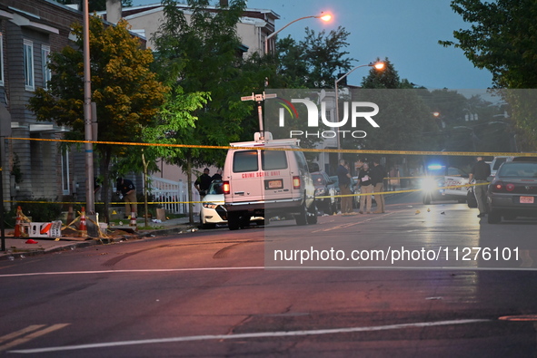 Police are present and evidence markers are highlighting shell casings at the crime scene. One person is killed and two people are injured i...