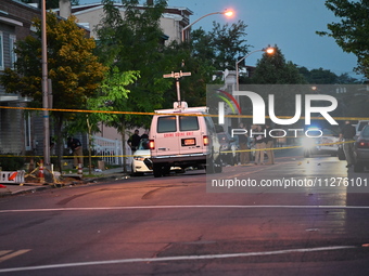 Police are present and evidence markers are highlighting shell casings at the crime scene. One person is killed and two people are injured i...