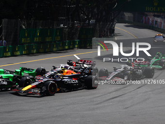 Sergio Perez of Red Bull Racing and Kevin Magnussen and Nico Hulkenberg of Haas during the Formula 1 Grand Prix of Monaco at Circuit de Mona...