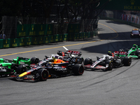 Sergio Perez of Red Bull Racing and Kevin Magnussen and Nico Hulkenberg of Haas during the Formula 1 Grand Prix of Monaco at Circuit de Mona...