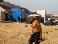 Palestinians are gathering on the beach in Deir el-Balah, central Gaza Strip, on May 26, 2024, amid the ongoing conflict between Israel and...