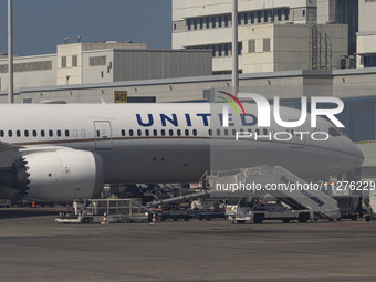 United Airlines Boeing 787-10 Dreamliner passenger plane in front of the terminal and the gates of Athens International Airport ATH in Greec...