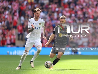 Joe Rodon (Leeds United) is taking on Adam Armstrong (Southampton) during the SkyBet Championship Playoff Final between Leeds United and Sou...