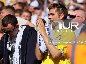 A Leeds fan is praying during the SkyBet Championship Playoff Final between Leeds United and Southampton at Wembley Stadium in London, Engla...