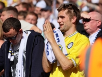 A Leeds fan is praying during the SkyBet Championship Playoff Final between Leeds United and Southampton at Wembley Stadium in London, Engla...