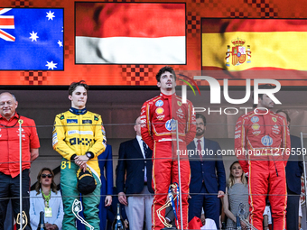 Frederic Vasseur, Oscar Piastri, Charles Leclerc, and Carlos Sainz are celebrating the final podium during the FIA Formula One World Champio...