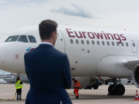 Hendrik Wuest, prime minister of NRW, is standing in front of a Eurowings aircraft at Cologne & Bonn Airport before the Bayer 04 Leverkusen...