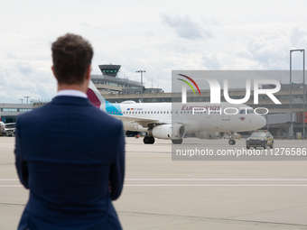 Hendrik Wuest, Prime Minister of NRW, is standing in front of a Eurowings aircraft at Cologne & Bonn Airport before the Bayer 04 Leverkusen...