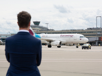 Hendrik Wuest, Prime Minister of NRW, is standing in front of a Eurowings aircraft at Cologne & Bonn Airport before the Bayer 04 Leverkusen...